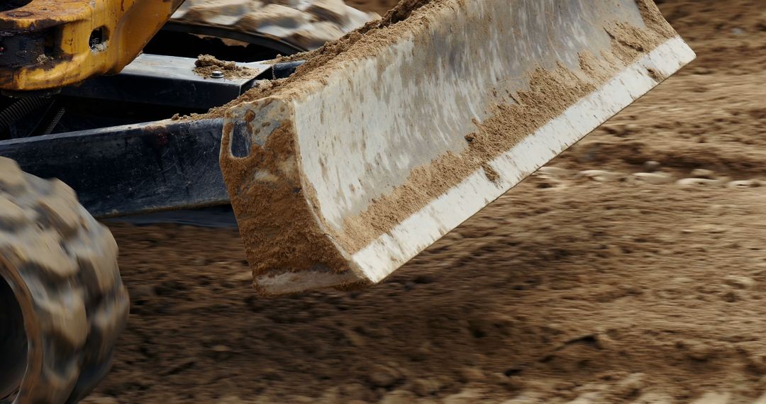 Close-up of Bulldozer Blade Moving Dirt at Construction Site - Free Images, Stock Photos and Pictures on Pikwizard.com