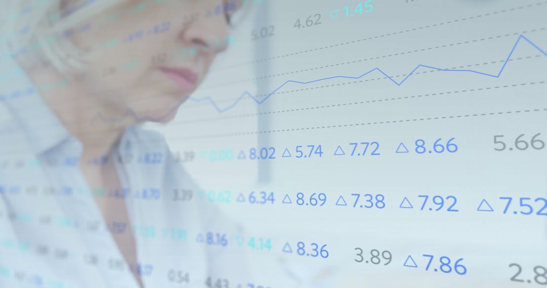 Senior Analyst Reviewing Financial Data with Graph Overlay
