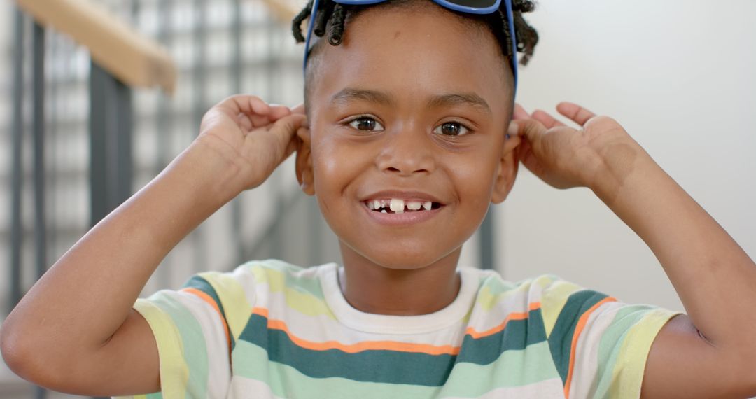 Cheerful African American Boy Smiling in Playful Mood at Home