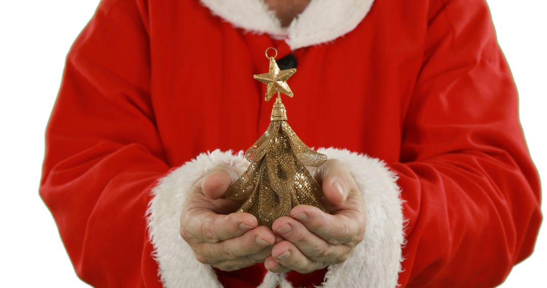 Santa Claus Holding Small Golden Christmas Tree Ornament - Free Images, Stock Photos and Pictures on Pikwizard.com