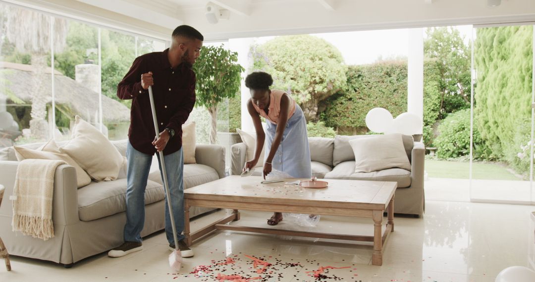 Couple Enjoying Teamwork While Tidying Living Room