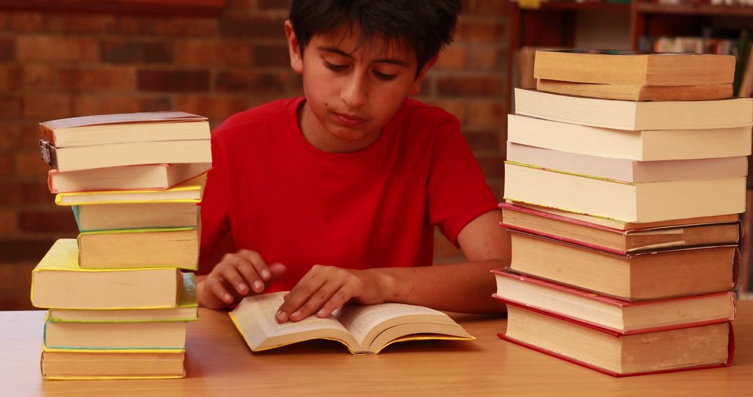 Young Boy Immersed in Reading Surrounded by Book Stacks