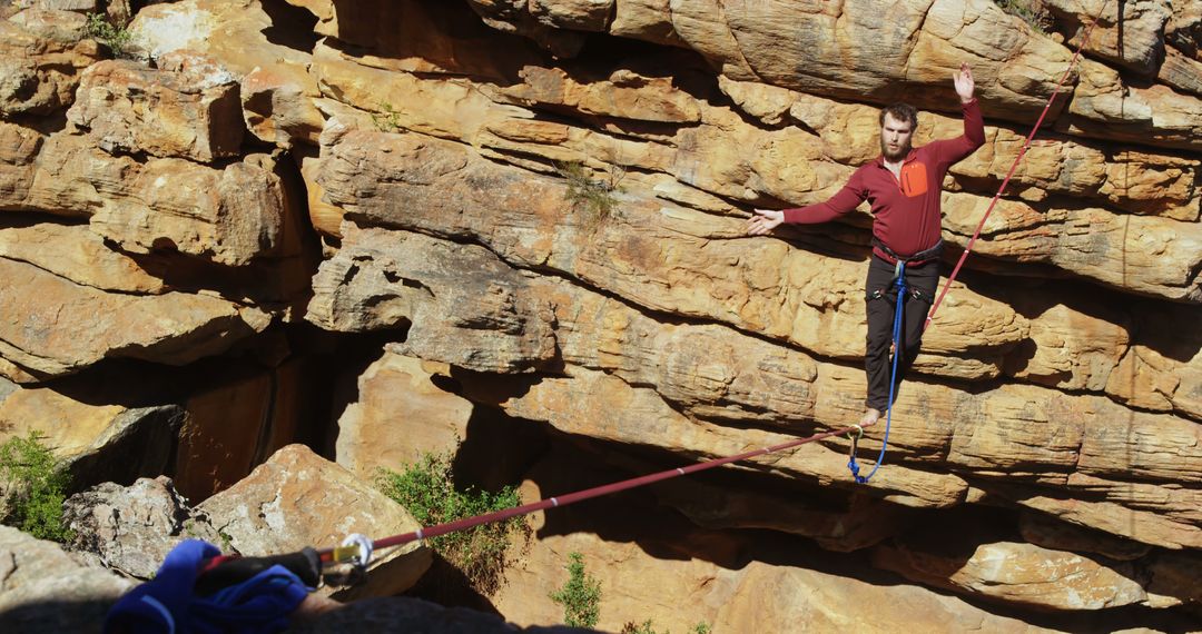 Man Balancing on Slackline over Rocky Canyon - Free Images, Stock Photos and Pictures on Pikwizard.com