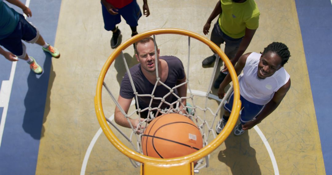 Group of multiracial athletes playing basketball outdoors from above - Free Images, Stock Photos and Pictures on Pikwizard.com