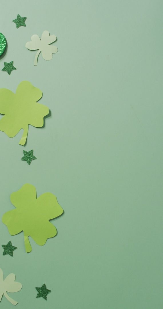 Vertical Display of Green Clover Leaves on Pastel Green Background - Free Images, Stock Photos and Pictures on Pikwizard.com