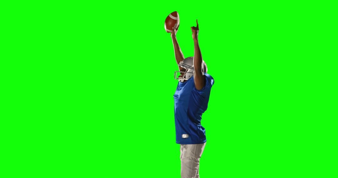 Football Player Celebrating Victory Holding Ball against Green Screen - Free Images, Stock Photos and Pictures on Pikwizard.com