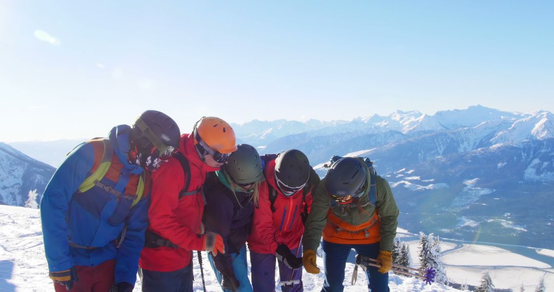 Group of Friends Skiing on Mountain with Scenic Snow-Capped Peaks - Free Images, Stock Photos and Pictures on Pikwizard.com