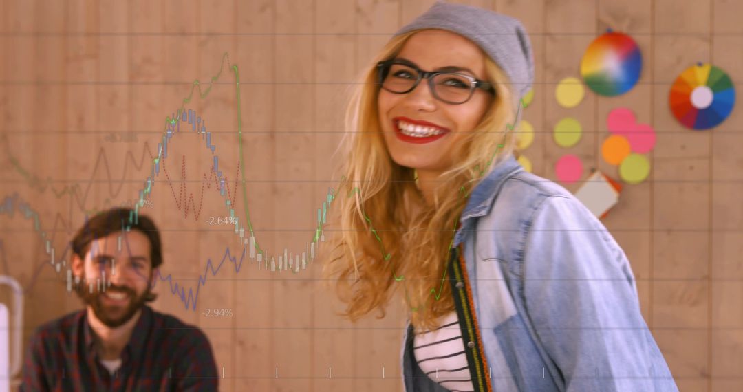 Creative Team Analyzing Financial Growth with Digital Graphics