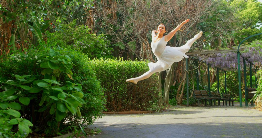 Elegant Ballet Dancer Leaping Gracefully Outdoors - Free Images, Stock Photos and Pictures on Pikwizard.com