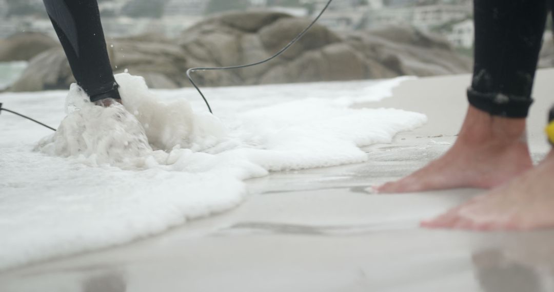 Surfers Gearing Up at Seashore, Footprints in Sand