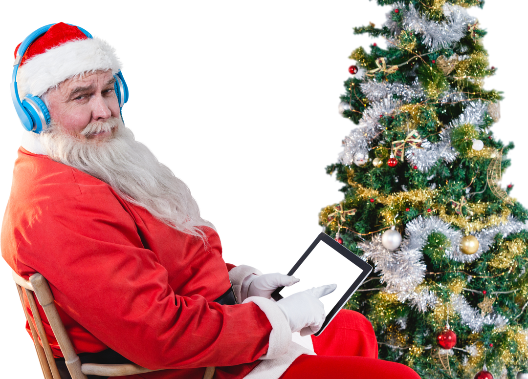 Modern Santa Claus Using Tablet Next to Christmas Tree, Transparent Background - Download Free Stock Images Pikwizard.com