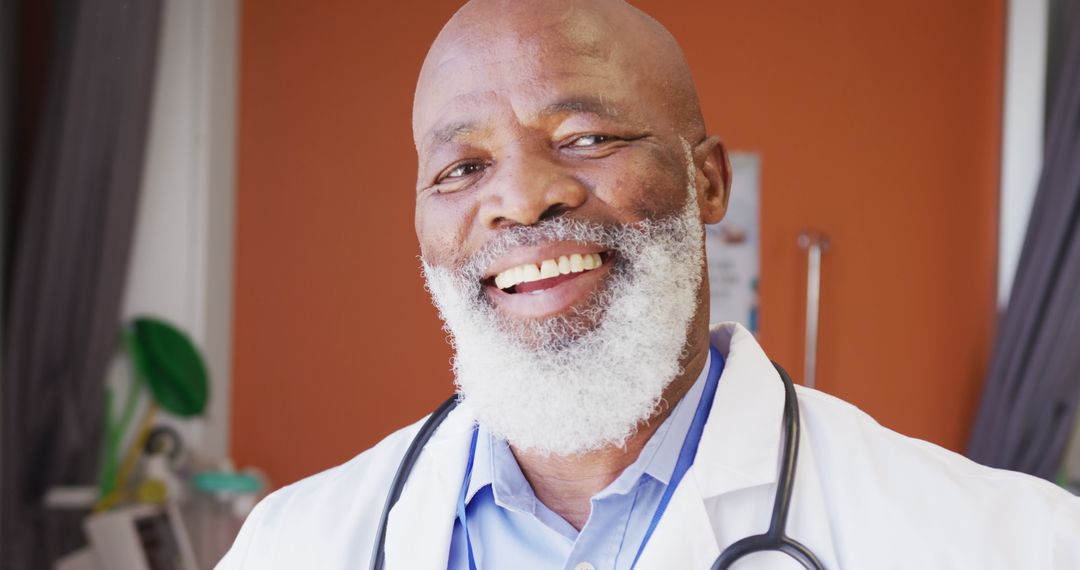 Confident Senior African-American Doctor Smiling in Hospital Setting - Free Images, Stock Photos and Pictures on Pikwizard.com