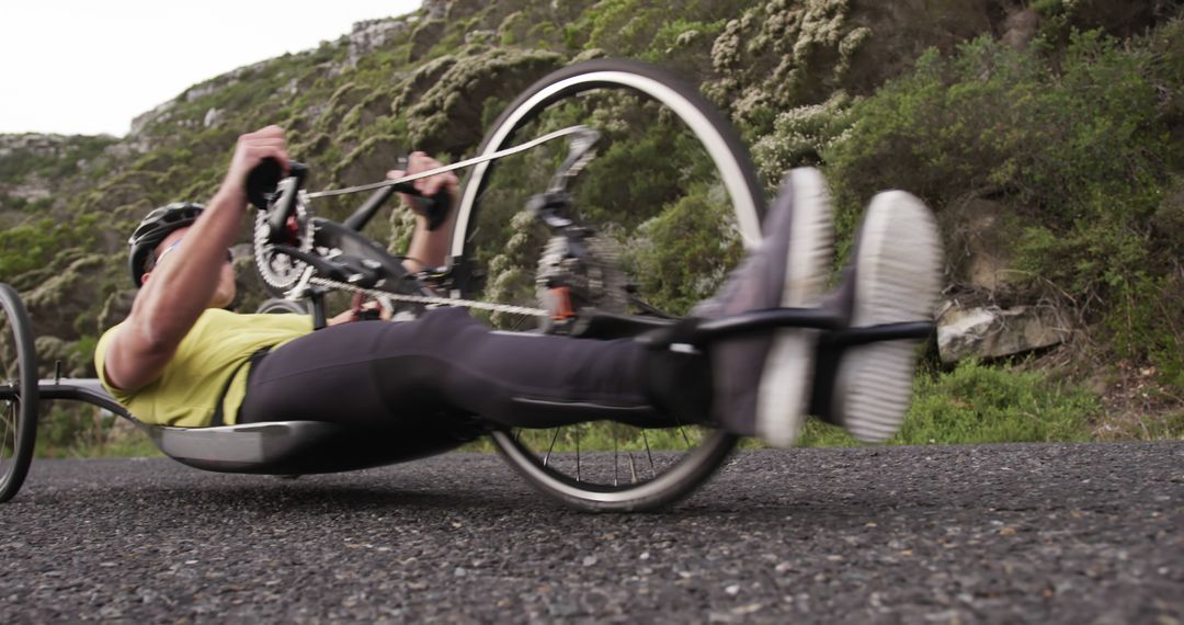 Athlete Handcycling Along Scenic Outdoor Trail - Free Images, Stock Photos and Pictures on Pikwizard.com