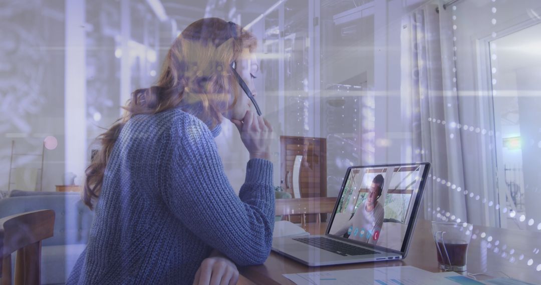 Woman on Video Call Wearing Headset Multitasking for Remote Meeting