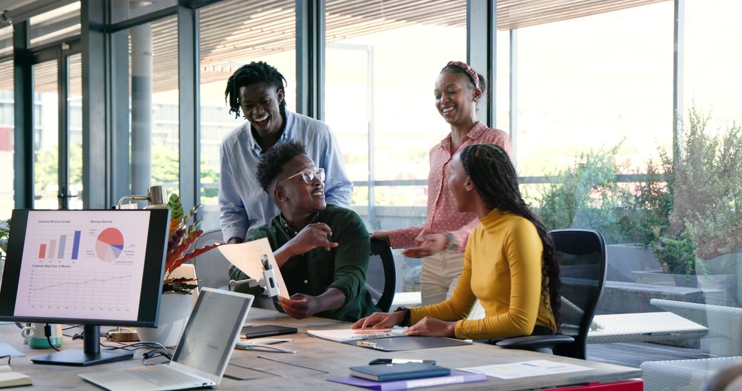 Team Collaborating Over Data in Modern Office Setting