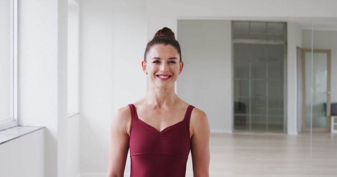 Smiling Female Dancer in Ballet Studio - Free Images, Stock Photos and Pictures on Pikwizard.com