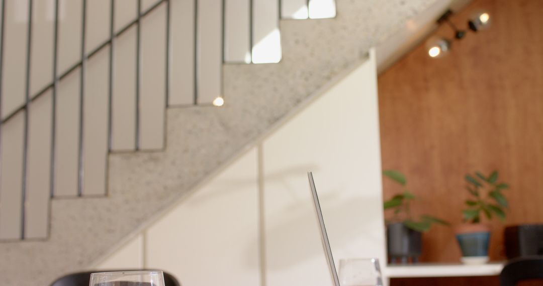 Cozy Laptop Workspace in Modern Minimalist Cafe