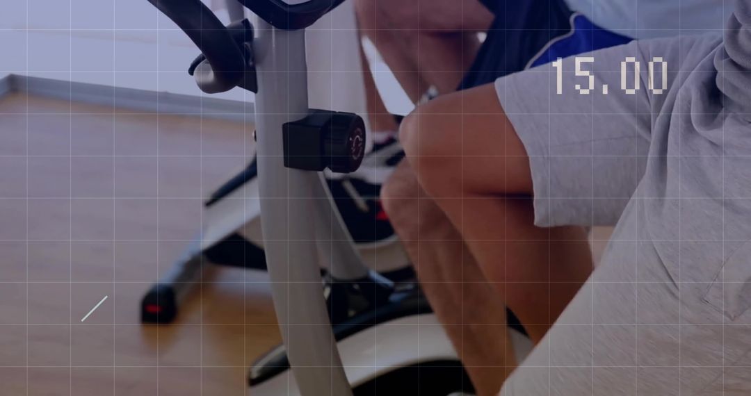 Focused Althete Using Cycling Machines in Modern Fitness Studio