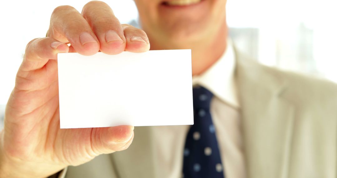 Businessman Holding Blank Business Card Close Up - Free Images, Stock Photos and Pictures on Pikwizard.com