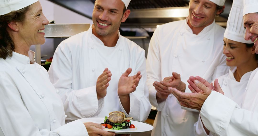 Group of Diverse Chefs Celebrating Culinary Success in Commercial Kitchen - Free Images, Stock Photos and Pictures on Pikwizard.com