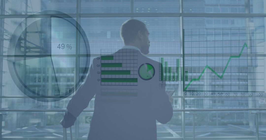 Businessman Analyzing Financial Growth with Graphs and Charts