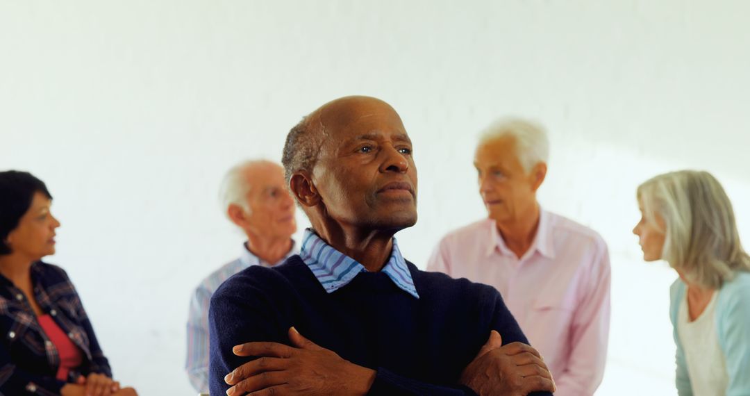 African American Man Reflecting in Group Therapy Session - Free Images, Stock Photos and Pictures on Pikwizard.com