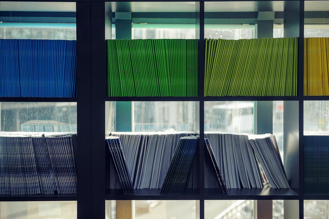 Colorful Notebooks Orgaized in Shelf
