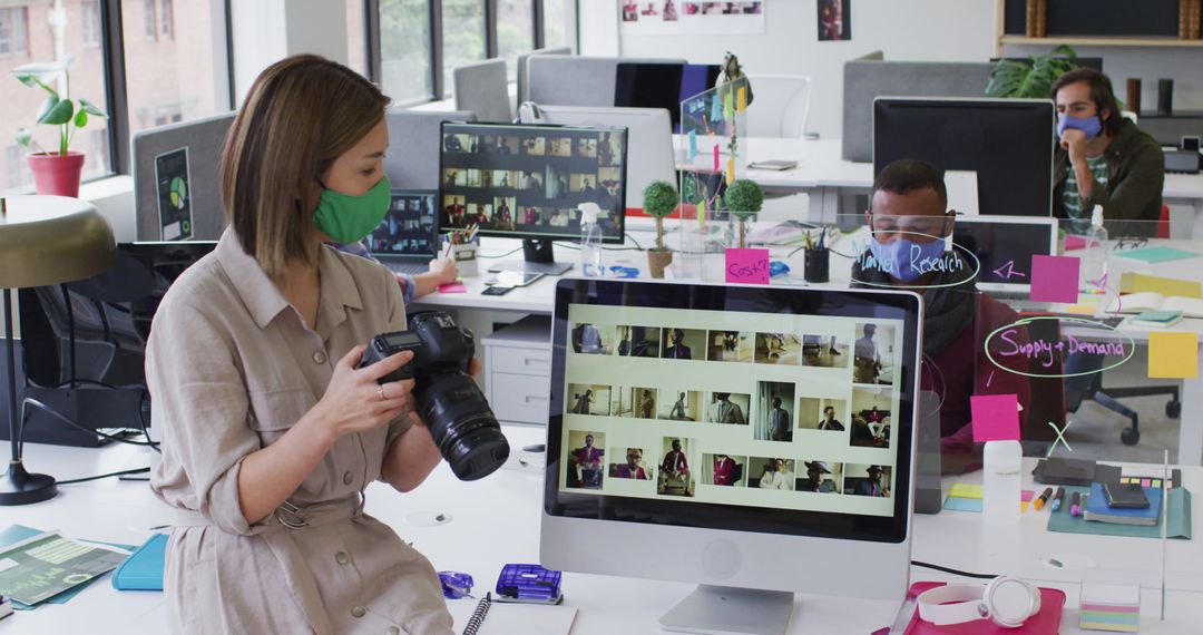 Businesswoman Using Camera in Modern Office - Free Images, Stock Photos and Pictures on Pikwizard.com