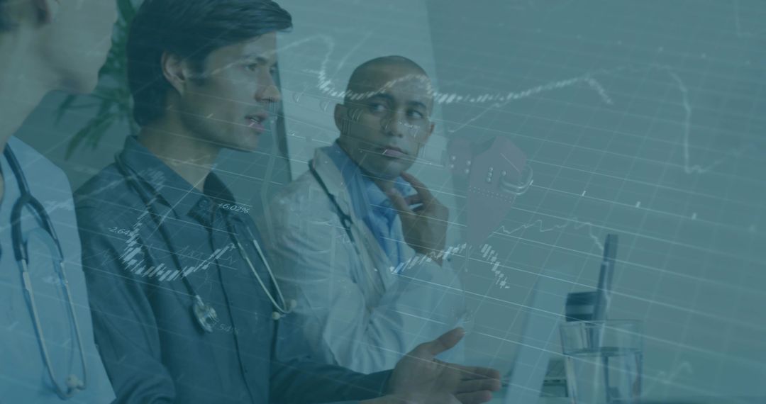 Doctors Discussing Healthcare Data Analytics with Laptops