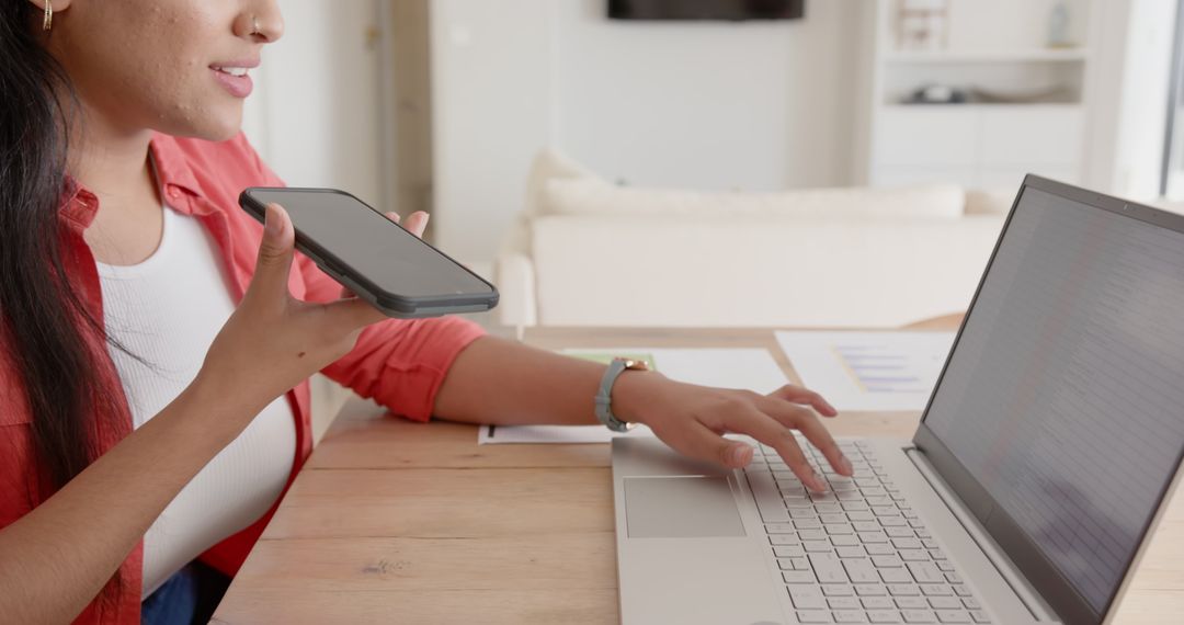 Young Woman Utilizing Smartphone Proximity Technology in Contemporary Office