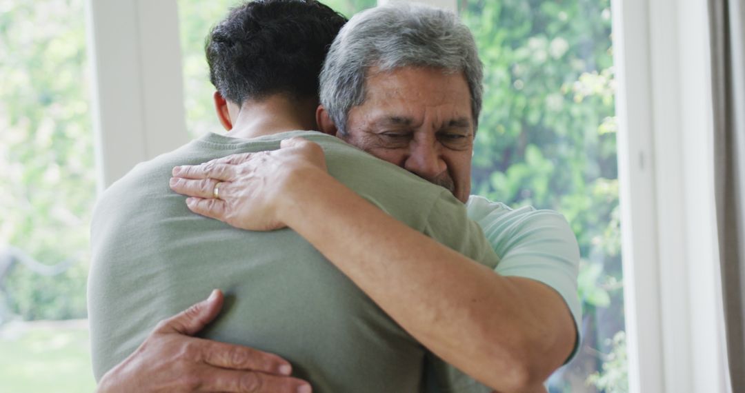 Heartfelt Hug Between Older and Younger Family Members - Free Images, Stock Photos and Pictures on Pikwizard.com