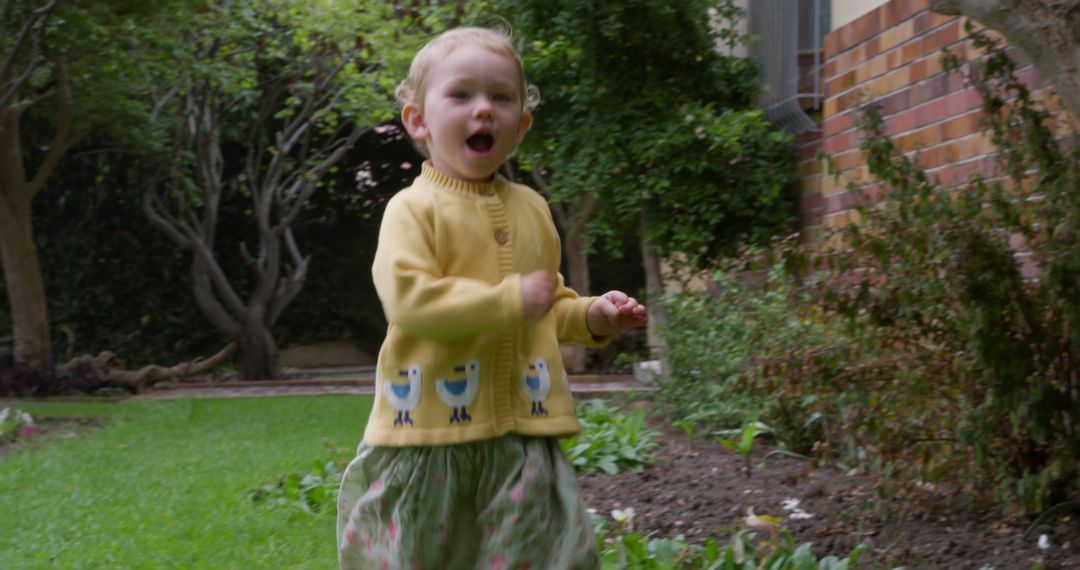 Joyful Child Running in a Garden Happily - Free Images, Stock Photos and Pictures on Pikwizard.com