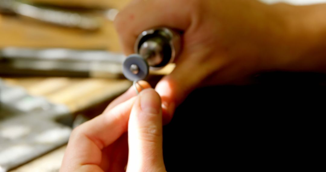 Close-Up of Hands Polishing with Rotary Tool in Workshop - Free Images, Stock Photos and Pictures on Pikwizard.com