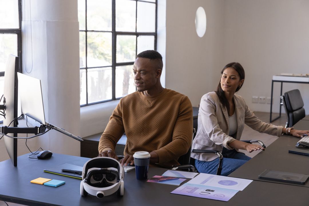 Diverse Professionals Collaborating with Tech Gadgets in Modern Workspace