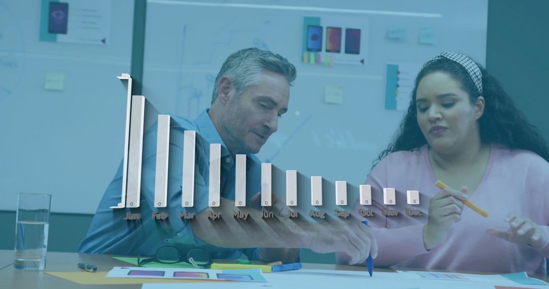 Diverse Team Analyzing Business Charts with Strategic Collaboration