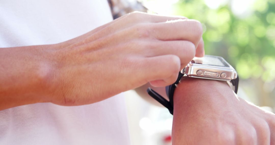 Close-Up of Person Using Smartwatch Outdoors - Free Images, Stock Photos and Pictures on Pikwizard.com