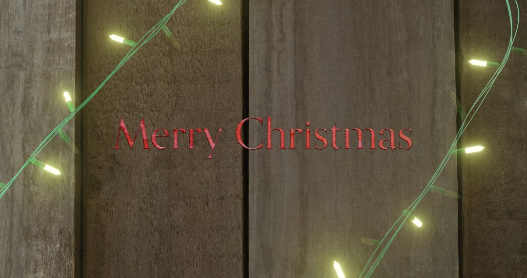 Merry Christmas Text on Wooden Background with Fairy Lights - Free Images, Stock Photos and Pictures on Pikwizard.com