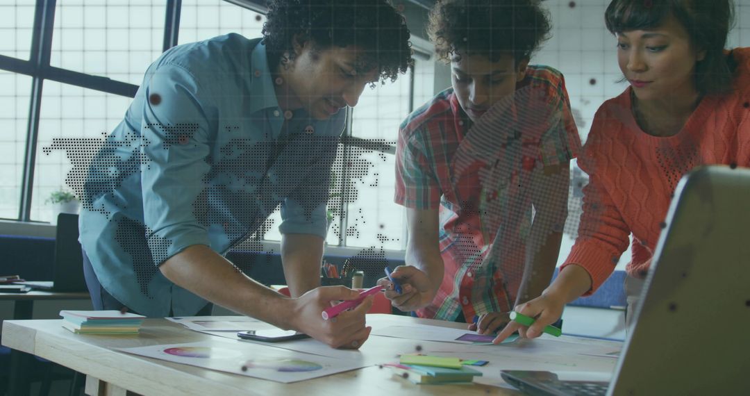 Diverse Team Analyzing Data in Modern Open Office