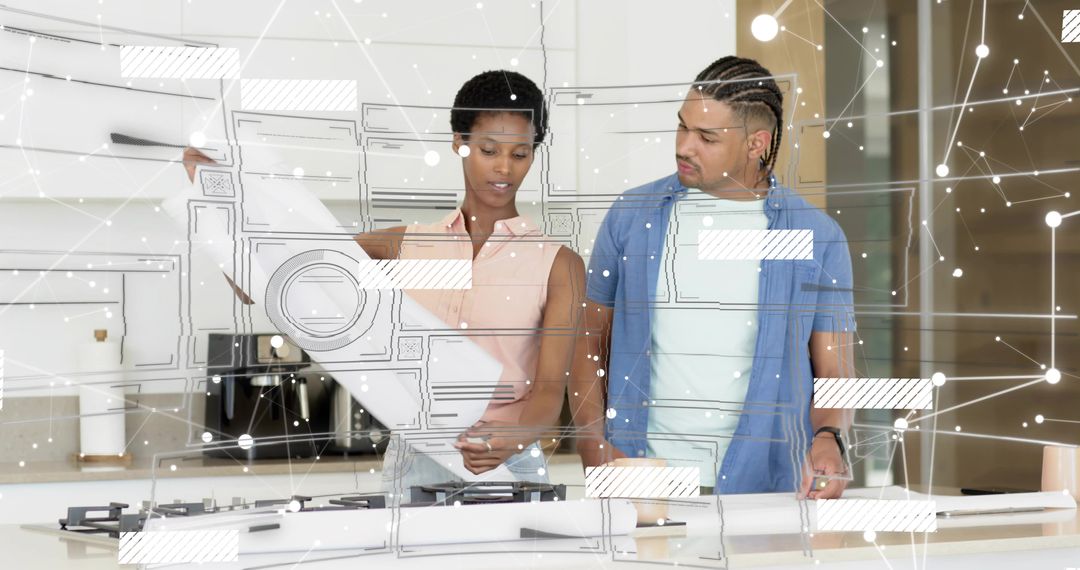 Couple Reviewing Kitchen Blueprint with Digital Overlay on Island for Renovation