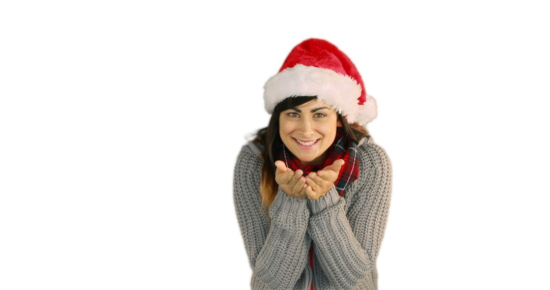 Happy Woman Wearing Santa Hat Blowing Kisses Isolated on White Background - Free Images, Stock Photos and Pictures on Pikwizard.com