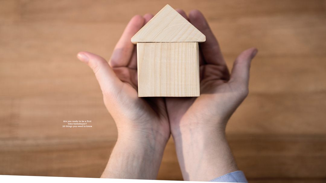 First-Time Homebuyer Holding Wooden House in Palms, Homeownership Concept