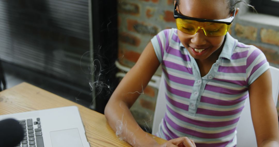 Young Girl in Protective Eyewear Experimenting with STEM Project - Free Images, Stock Photos and Pictures on Pikwizard.com