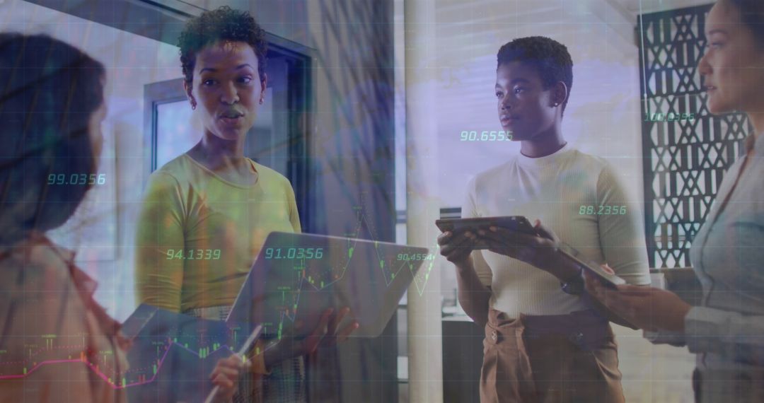 Diverse Businesswomen Discussing Finance and Technology Solutions