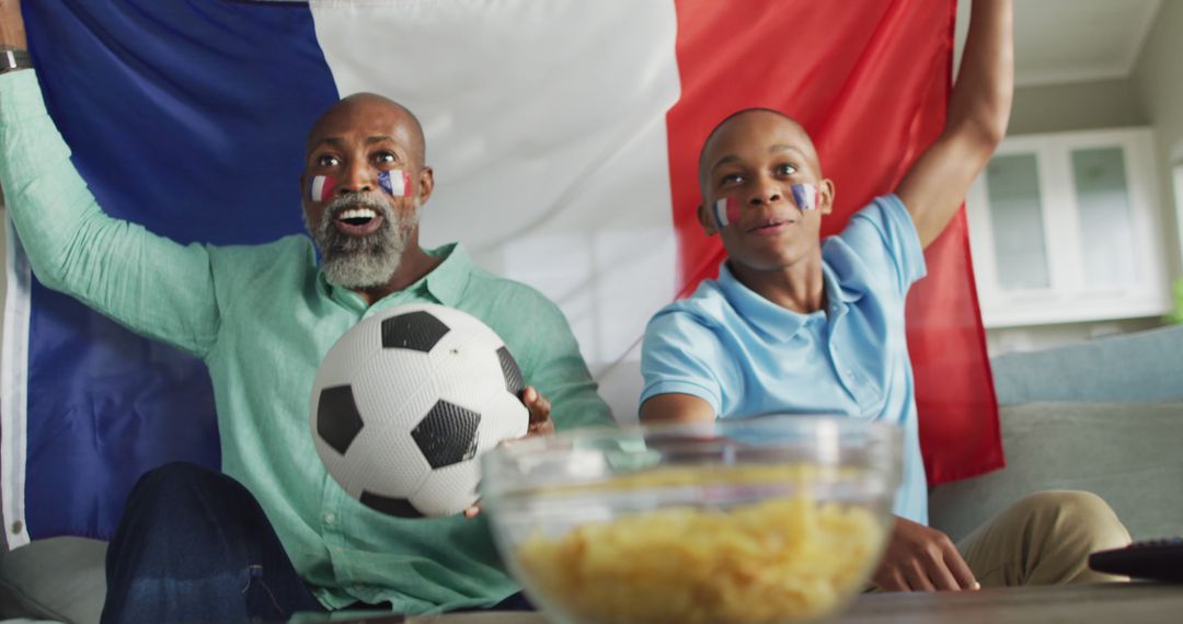 Father and Son Cheering France with Soccer Ball - Free Images, Stock Photos and Pictures on Pikwizard.com