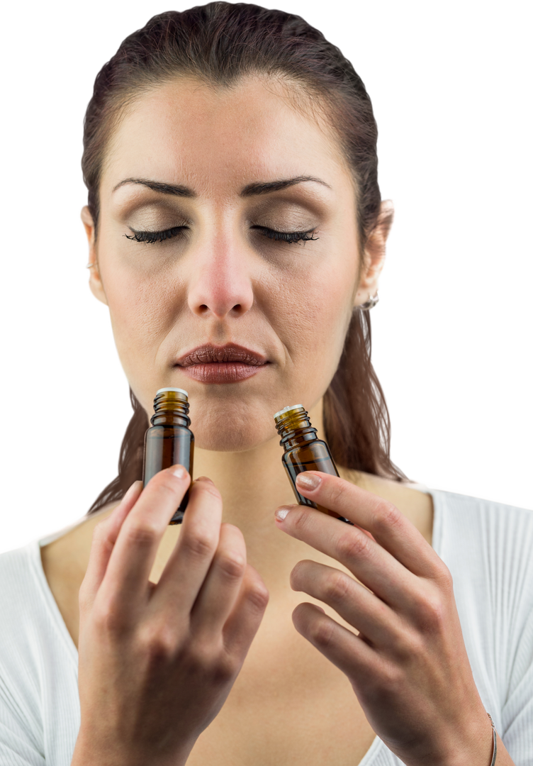 Close-up of Woman Holding and Smelling Transparent Medicine Bottles - Download Free Stock Images Pikwizard.com