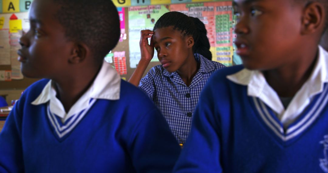 Group of African Schoolchildren in Uniform Paying Attention in Classroom - Free Images, Stock Photos and Pictures on Pikwizard.com