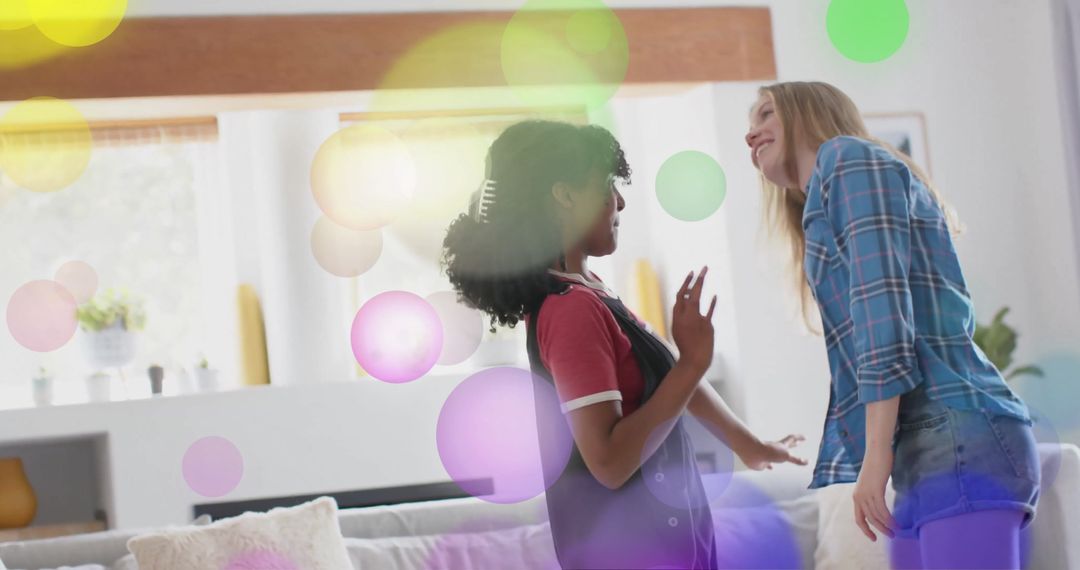 Joyful Teenagers Dancing at Home with Vibrant Light Effects