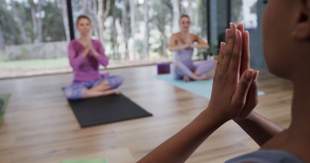 Group Practicing Yoga Meditation in Bright Studio - Free Images, Stock Photos and Pictures on Pikwizard.com