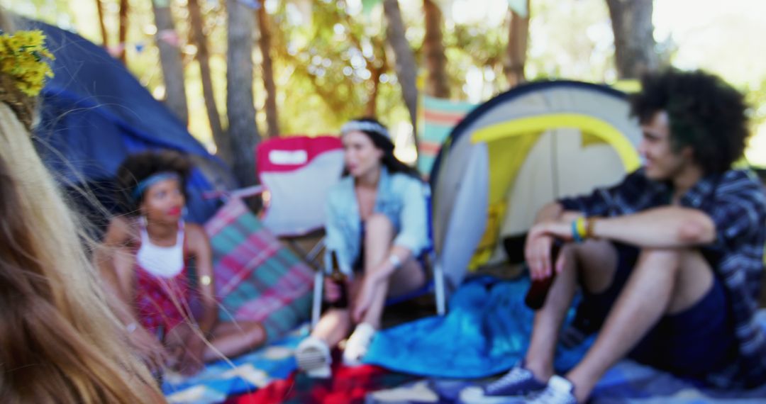 Young Adults Enjoying Relaxed Camping Trip Conversation - Free Images, Stock Photos and Pictures on Pikwizard.com