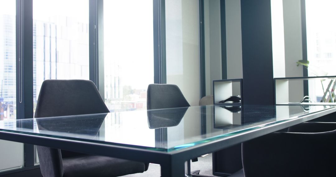 Modern Glass Conference Table in Sunlit Office